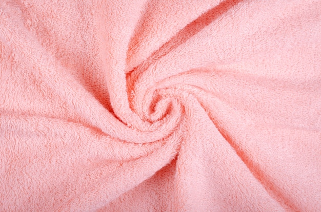 Pink towel fabric texture, top view photo.