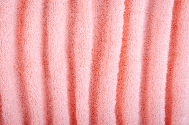 Pink towel fabric texture, top view photo.