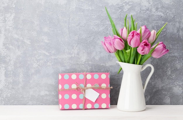 Pink tulip flowers bouquet and gift box