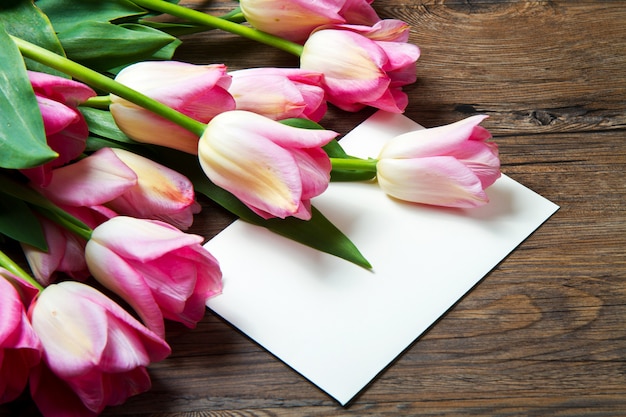 pink tulips with postcard