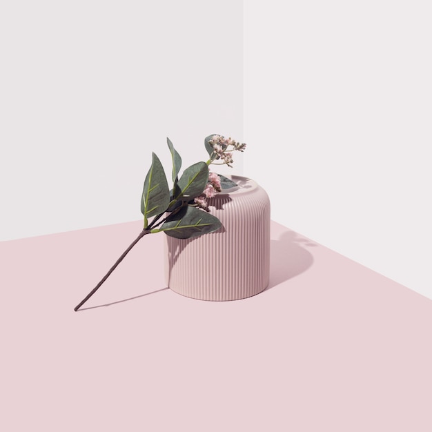 Pink vase with one flower against soft background Modern pastel minimal aesthetic composition