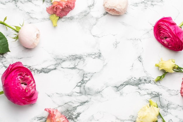 Pink and white flower bouquet on marble background with copyspace top view