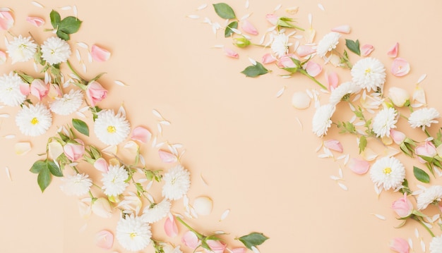 Pink and white flowers on paper surface