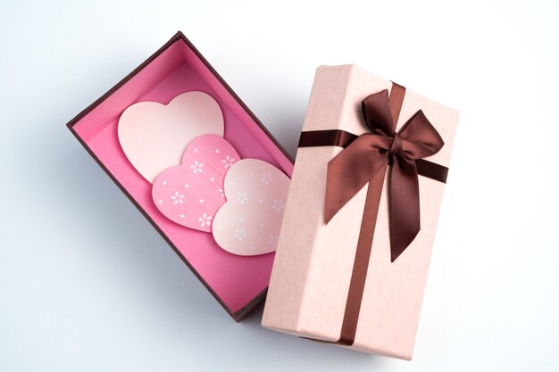 Pink and white hearts in a gift box.