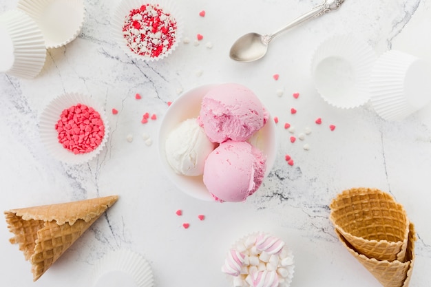 Pink and white ice cream in bowl