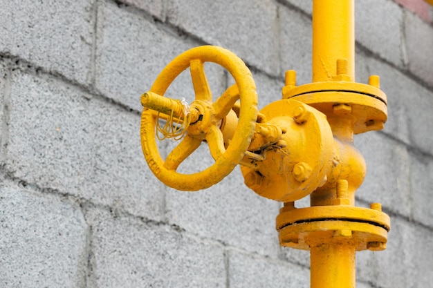 Pipeline with valve. Yellow tube with crane, oil and gas industry