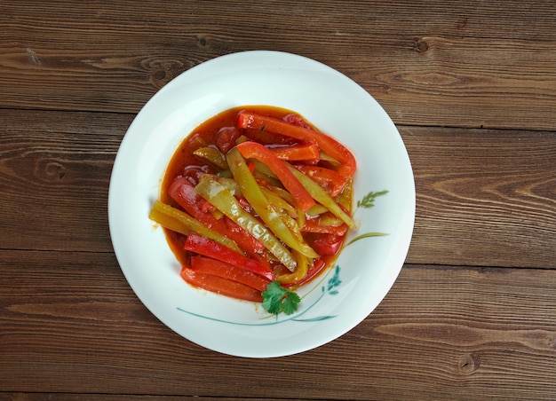 Piperade -  typical Basque dish prepared with onion, green peppers, and tomatoes