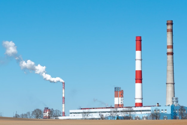 Pipes and other metal structures closeup Flue gas emissions and atmospheric air pollution Horizontal gas exhaust pipes on the territory of the factory