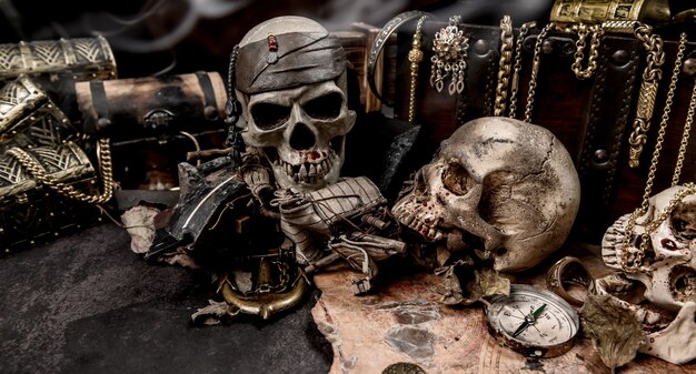 Pirate with human skull. Treasure chest and gold. Discovery equipment and explorer for disappear fortune.