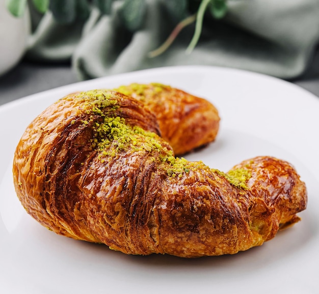 Pistachio Croissant on plate closeup