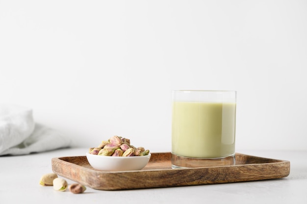 Pistachio milk in glass lactose free Vegan plant based milk