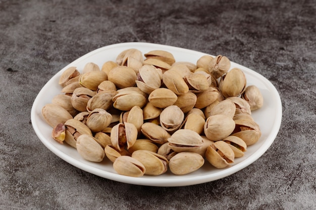 Pistachios are delicious nuts on a plate