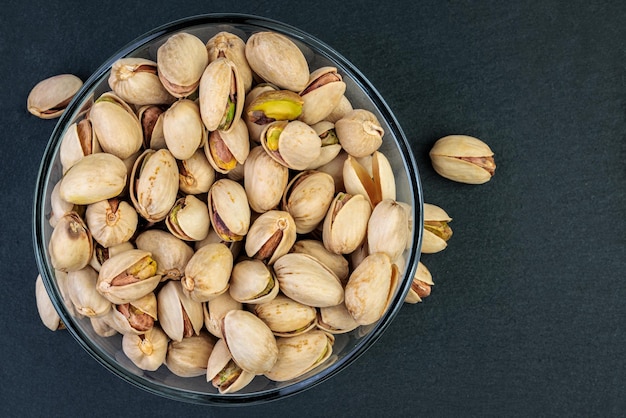 Pistachios in a glass bowl.