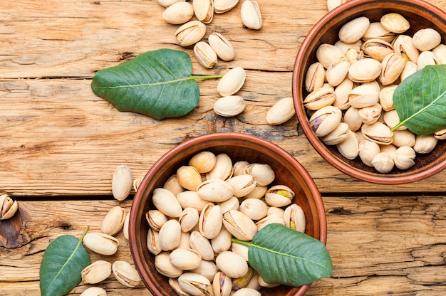 Pistachios nuts on wooden table