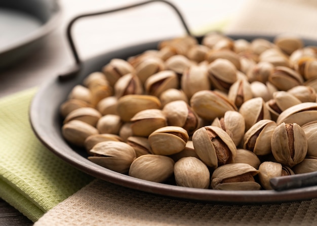 pistachios on a tray on the table