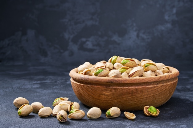 Pistachios in wooden bowl