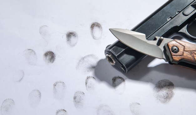 Pistol and knife on fingerprints ID for criminal