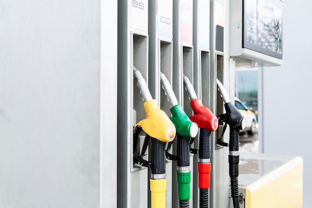 Pistols at gas stations with different types of gasoline Closeup Crisis in the supply of petroleum products