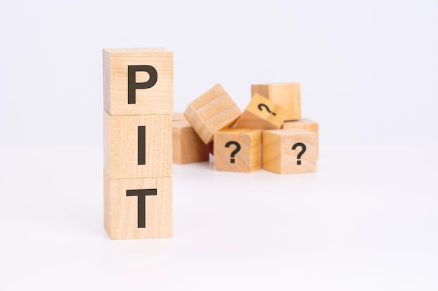 Pit personal income tax text on wooden cubes