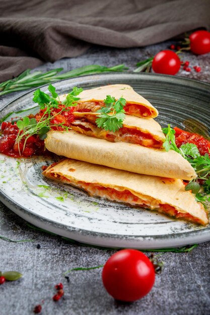 Pita bread with chicken and cheese filling Pancakes with tomato filling