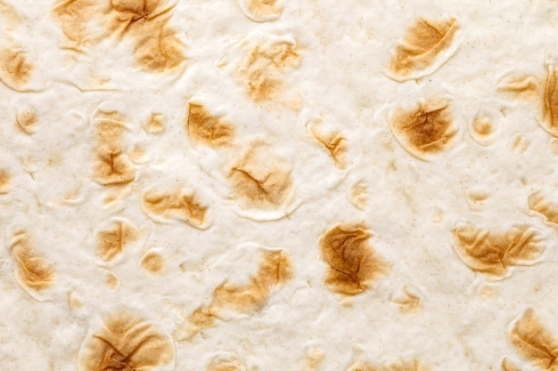 Pita tortilla closeup baked uniform texture background