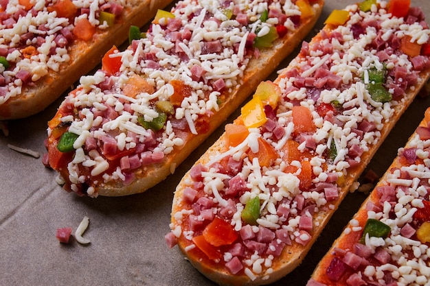 Pizza on a baguette top view closeup no people fast food street food