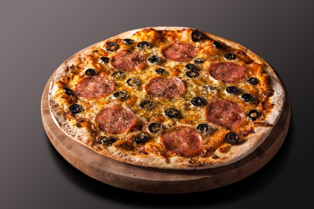 Pizza Calabrese on wooden board