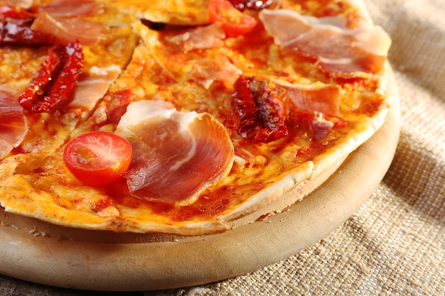 Pizza on cutting board closeup