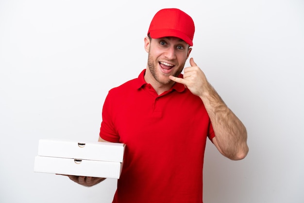 Pizza delivery caucasian man with work uniform picking up pizza boxes isolated on white background making phone gesture Call me back sign