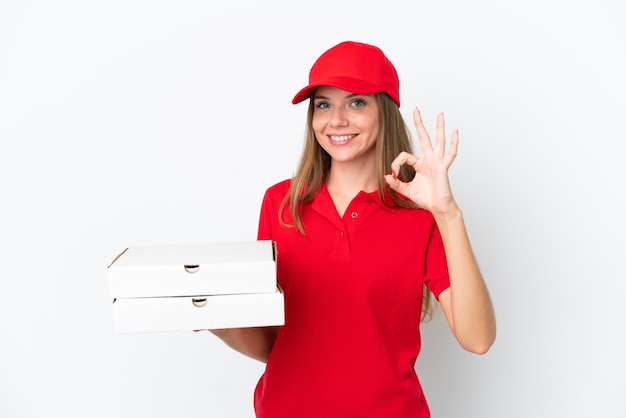 Pizza delivery Lithuanian woman isolated on white background showing ok sign with fingers