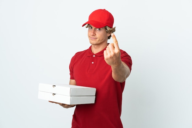 Pizza delivery man over isolated white background doing coming gesture