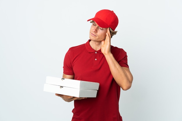 Pizza delivery man over isolated white background with headache