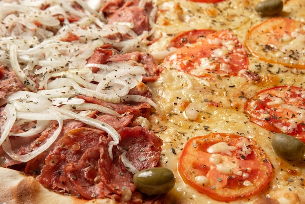 Pizza, detail of a pizza in Brazil with two flavors of mozzarella and pepperoni, selective focus