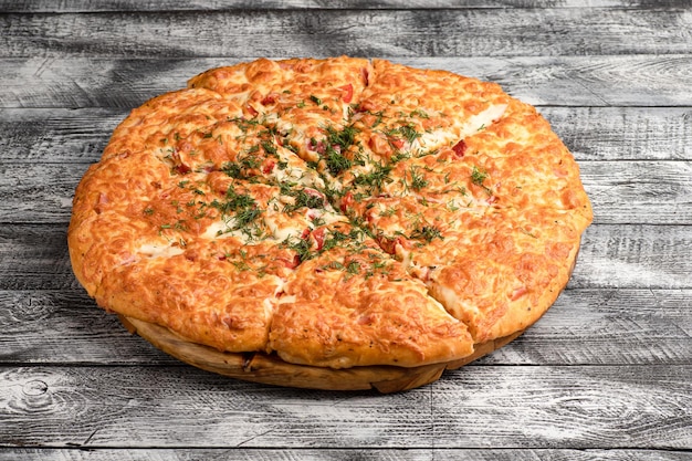 Pizza homemade large size pizza on a wooden white background