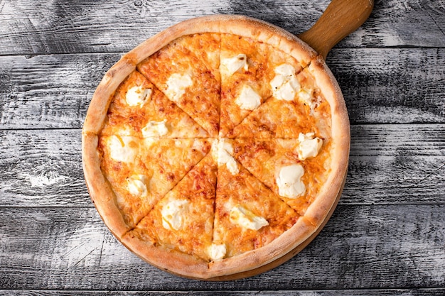 Pizza hot pizza on a white wooden background side and top view