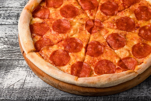 Pizza hot pizza on a white wooden background side and top view