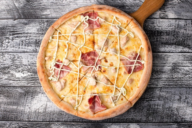 Pizza hot pizza on a white wooden background side and top view