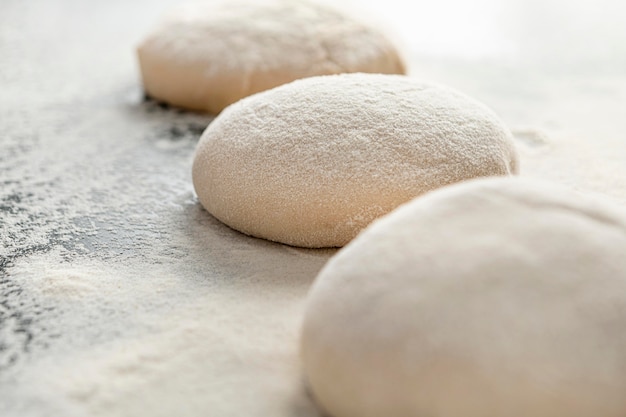 Pizza pieces of dough on table