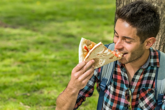 Pizza time.Student having lunch break.