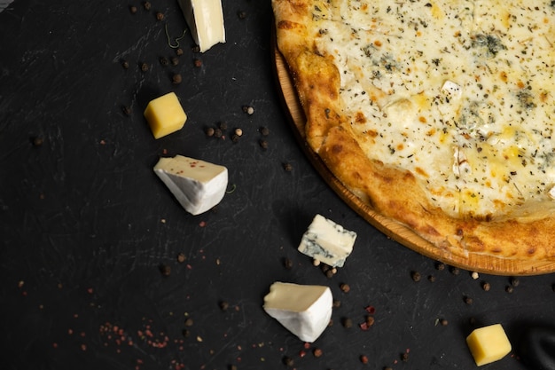 Pizza with cheese on a black background Khachapuri