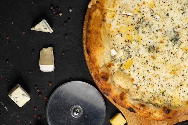 Pizza with cheese on a black background Khachapuri