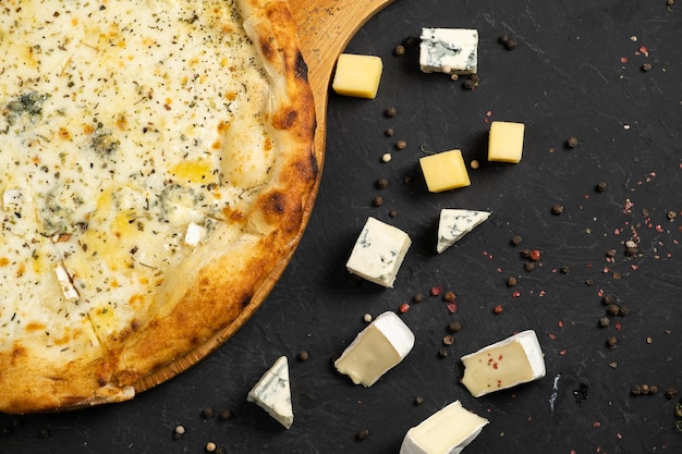 Pizza with cheese on a black background Khachapuri