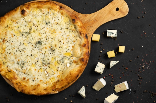 Pizza with cheese on a black background Khachapuri