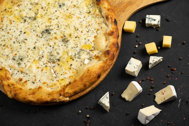 Pizza with cheese on a black background Khachapuri