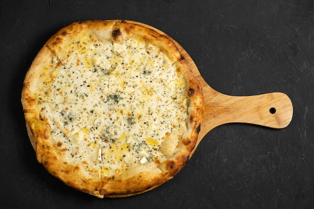 Pizza with cheese on a black background Khachapuri