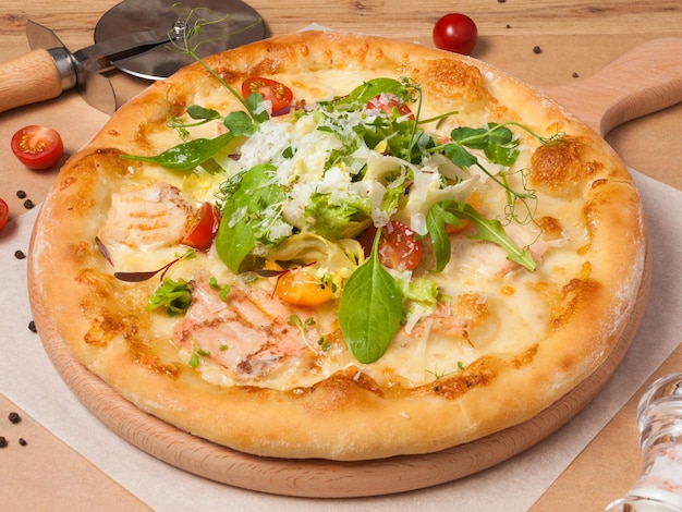 Pizza with chicken fillet vegetables and parmesan