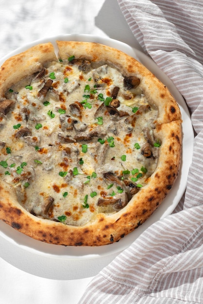 Pizza with mushrooms and truffle sauce on white background for restaurant menu