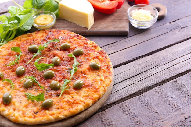 Pizza on wooden background