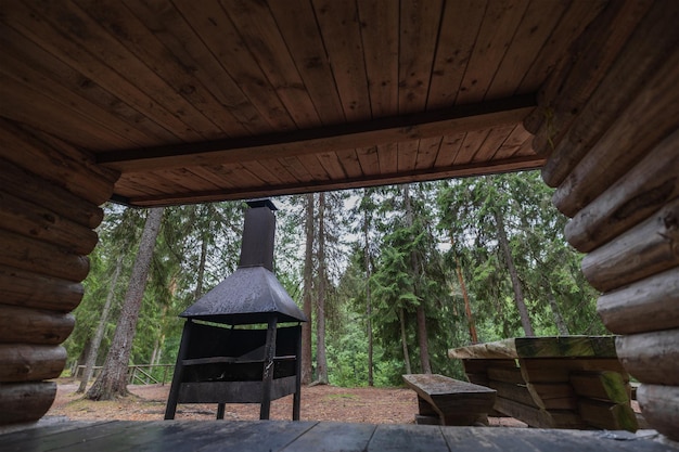 Place for outdoor recreation in Estonia in the forest camping place barbecue wooden table and bench