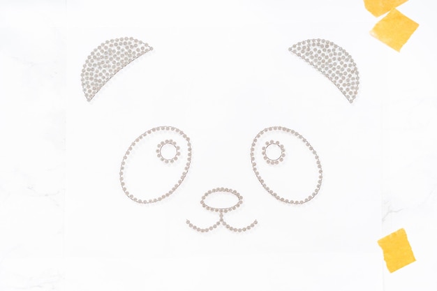 Placing rhinestones on top of rhinestone transfer film